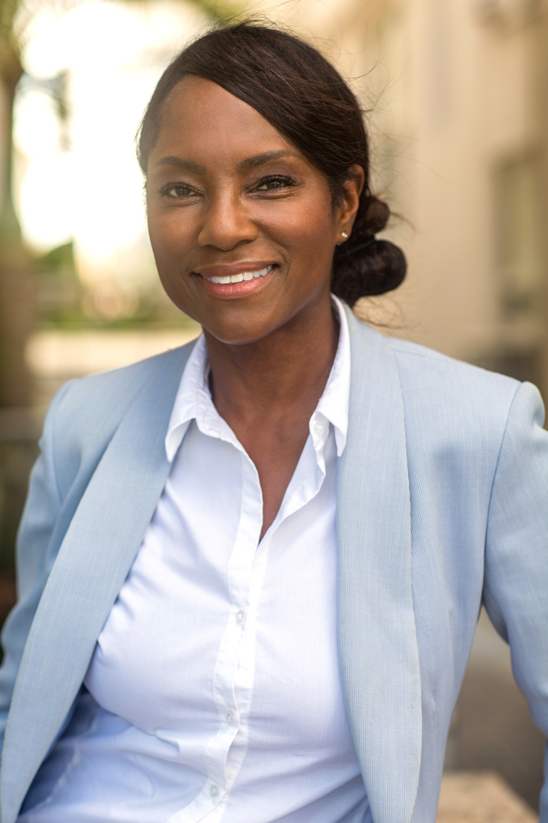 Portrait of a black mature healthy older woman smiling.